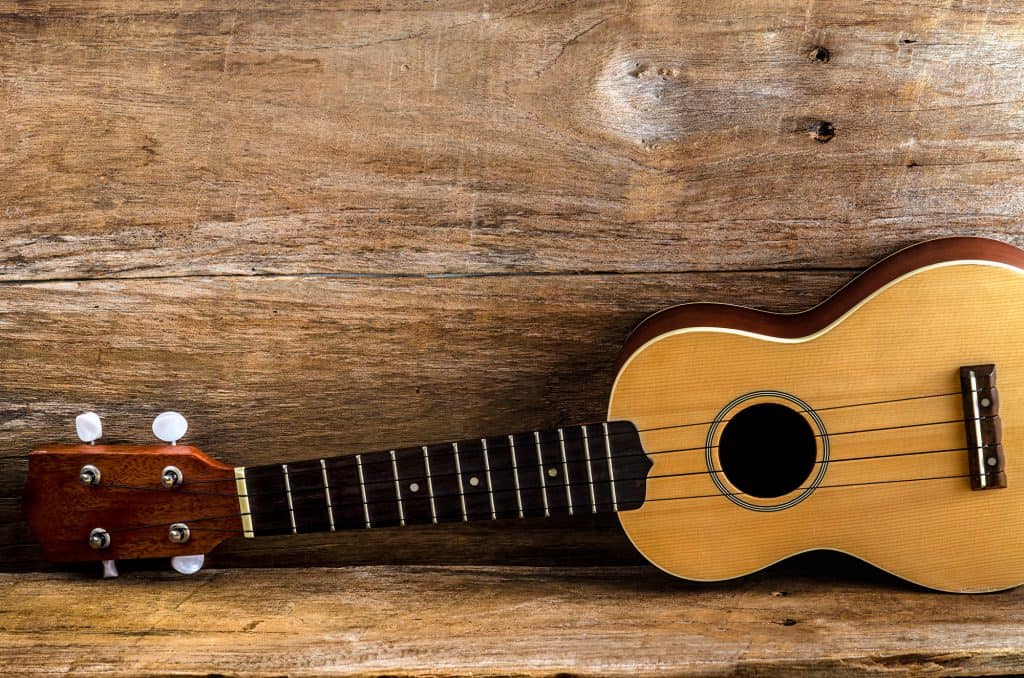 Left handed ukulele on a wood