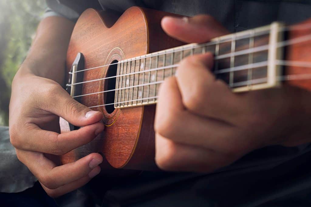 man holding a ukulele
